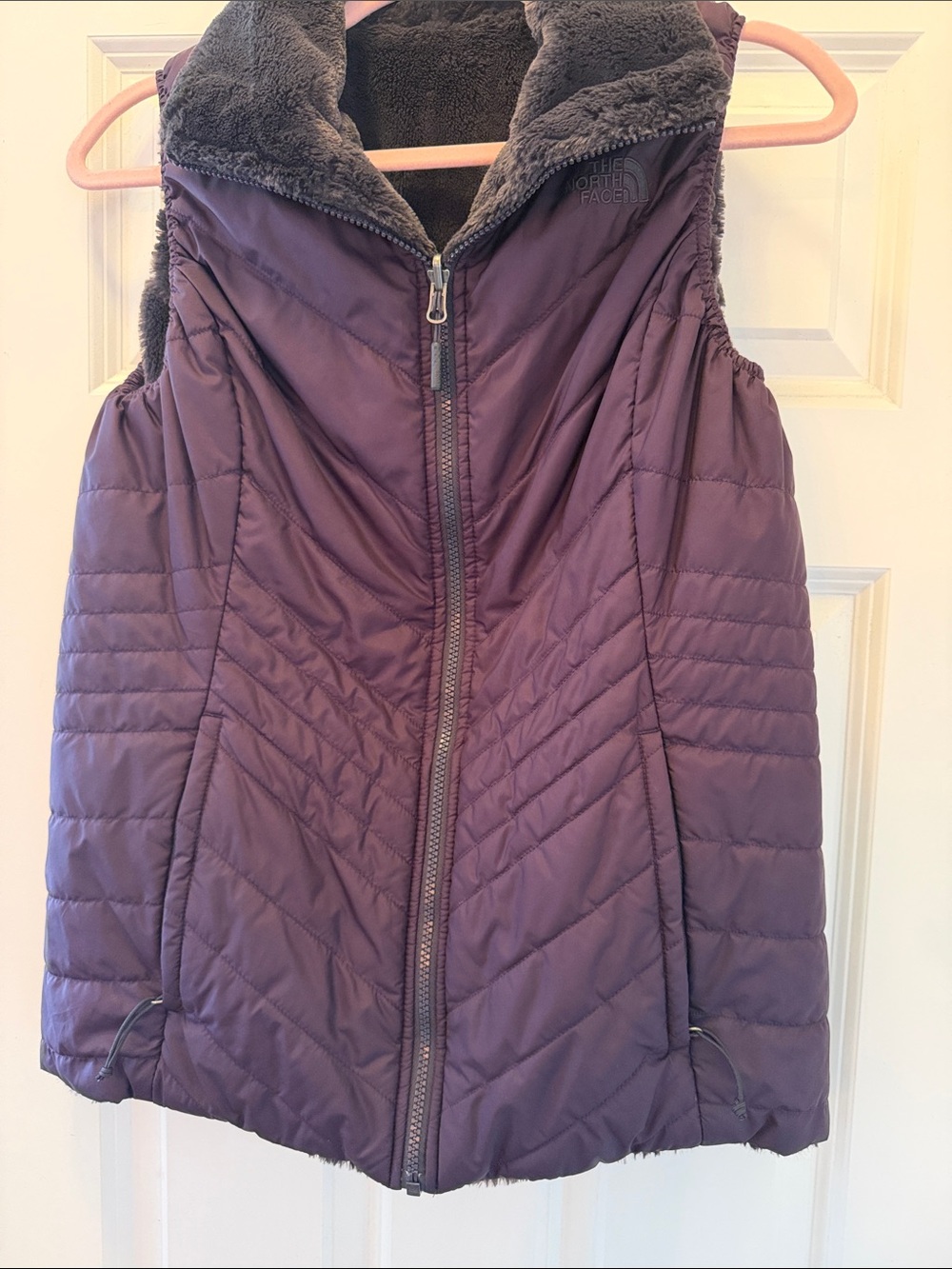 The Reversible North Face Women's Plum Quilted Vest with Black Fleece